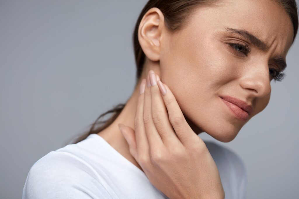 A woman with jaw pain